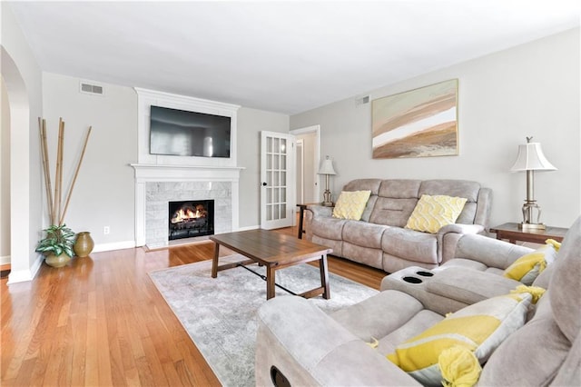 1359 Scott Blvd, Decatur, GA 30030 - living area with wood finished floors, arched walkways, and a tiled fireplace