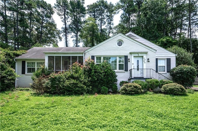 1359 Scott Blvd, Decatur, GA 30030 - single story home featuring brick siding, a front yard, and a sunroom