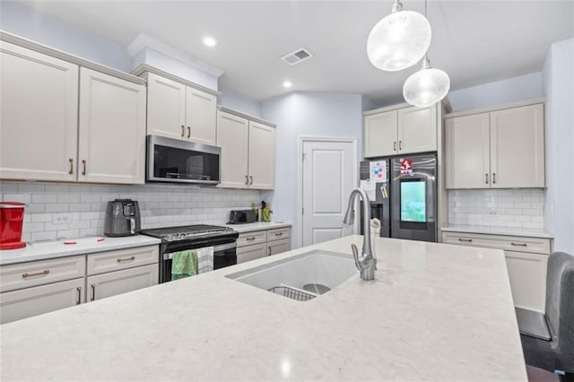 55 Clubhouse Way, Acworth, GA 30101 - kitchen featuring appliances with stainless steel finishes, a sink, decorative light fixtures, decorative backsplash, and recessed lighting