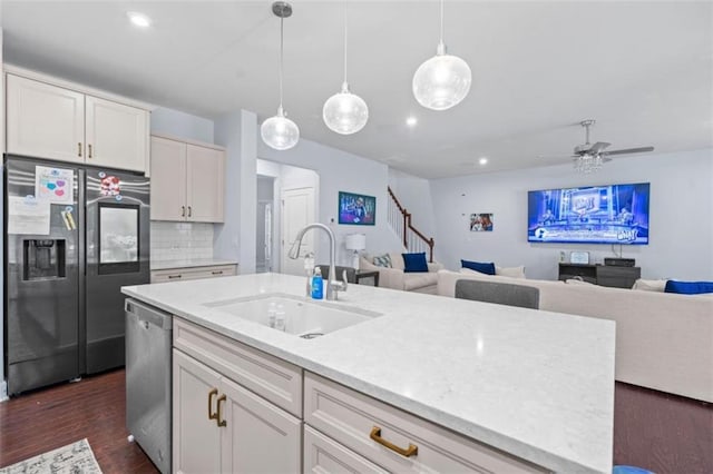 55 Clubhouse Way, Acworth, GA 30101 - kitchen with stainless steel appliances, a sink, tasteful backsplash, dark wood finished floors, and white cabinets