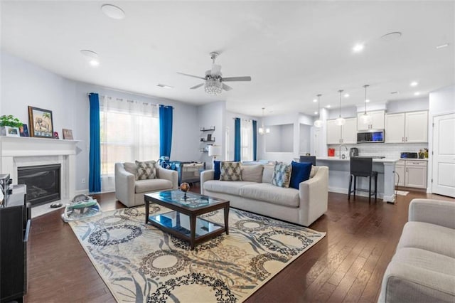55 Clubhouse Way, Acworth, GA 30101 - living room featuring ceiling fan, dark wood finished floors, a glass covered fireplace, and recessed lighting