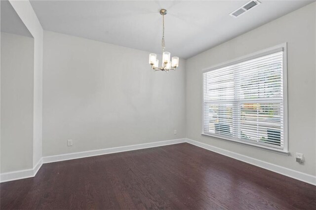 55 Clubhouse Way, Acworth, GA 30101 - spare room featuring dark wood finished floors, a chandelier, and baseboards