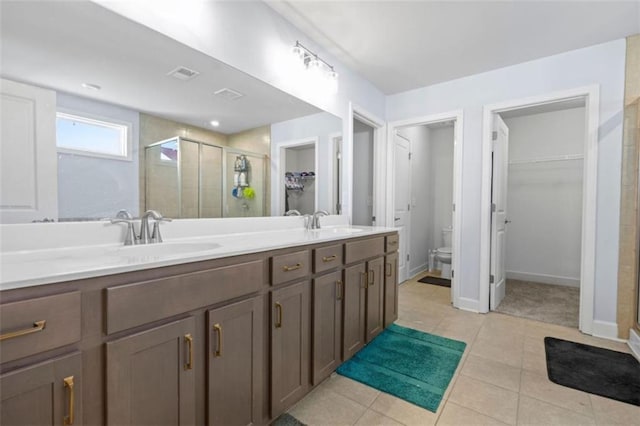 55 Clubhouse Way, Acworth, GA 30101 - full bathroom with a shower stall, a walk in closet, double vanity, and toilet