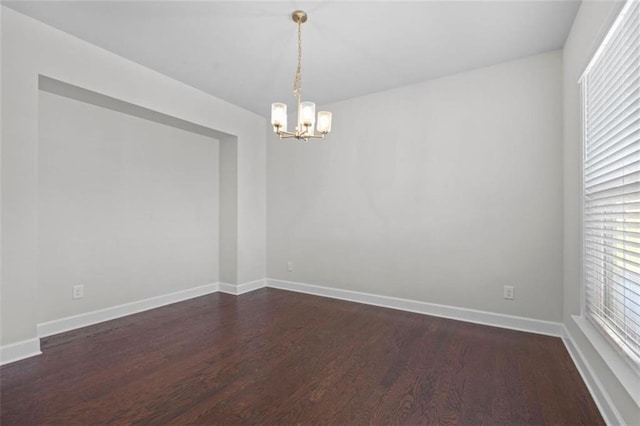 55 Clubhouse Way, Acworth, GA 30101 - spare room with a chandelier, dark wood-style flooring, and baseboards