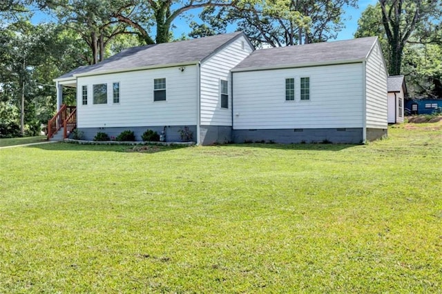 view of side of property with a yard