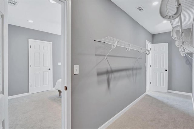 walk in closet featuring carpet and visible vents