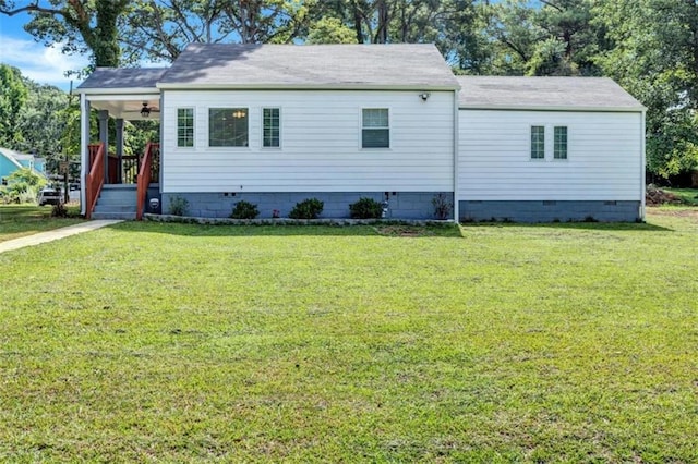 view of front of property with a front yard and crawl space
