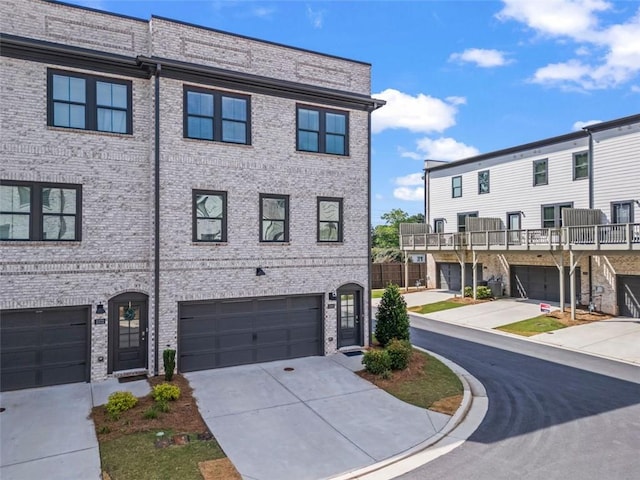 3382 Monarch Ave, Duluth, GA 30096 - view of front of property featuring driveway, an attached garage, and brick siding