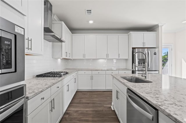 3382 Monarch Ave, Duluth, GA 30096 - kitchen with wall chimney exhaust hood, appliances with stainless steel finishes, white cabinets, decorative backsplash, and dark wood-style floors