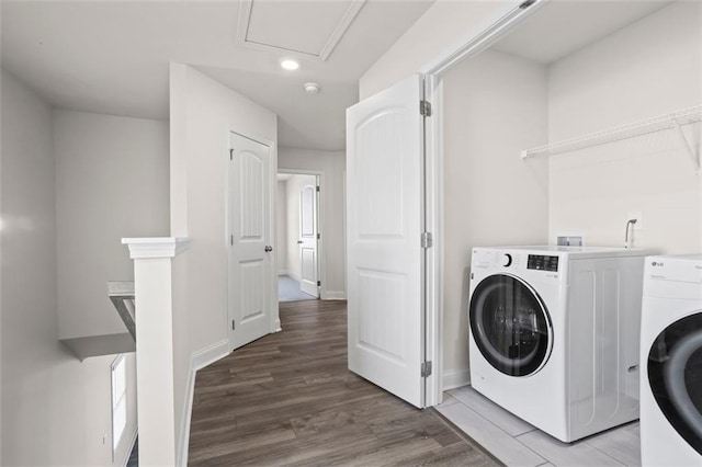3382 Monarch Ave, Duluth, GA 30096 - washroom featuring light wood-type flooring, recessed lighting, and washing machine and clothes dryer