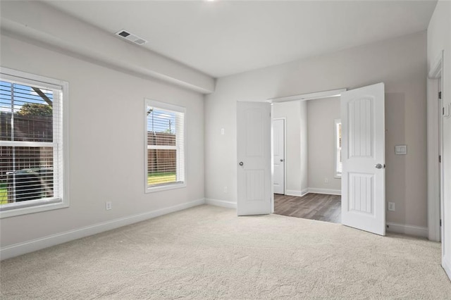 3382 Monarch Ave, Duluth, GA 30096 - unfurnished bedroom with carpet flooring and multiple windows