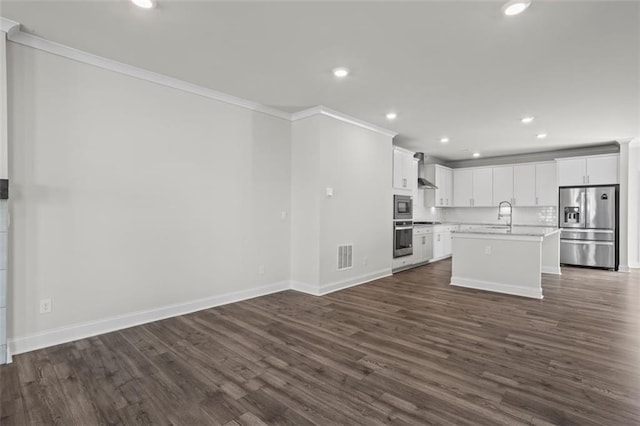 3382 Monarch Ave, Duluth, GA 30096 - kitchen featuring appliances with stainless steel finishes, crown molding, open floor plan, light countertops, and dark wood-type flooring