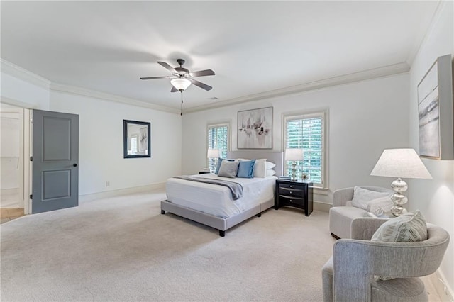 bedroom featuring ceiling fan, crown molding, and light colored carpet