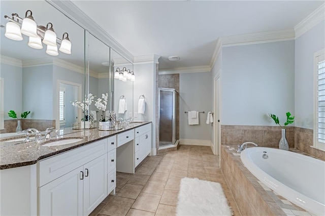 bathroom with tile patterned flooring, plus walk in shower, vanity, and ornamental molding