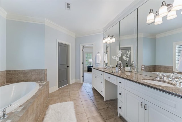 bathroom featuring tile patterned flooring, a relaxing tiled tub, crown molding, and vanity