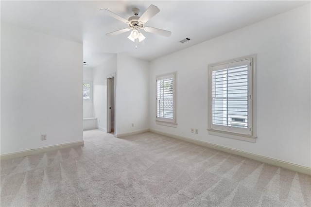 carpeted empty room with ceiling fan