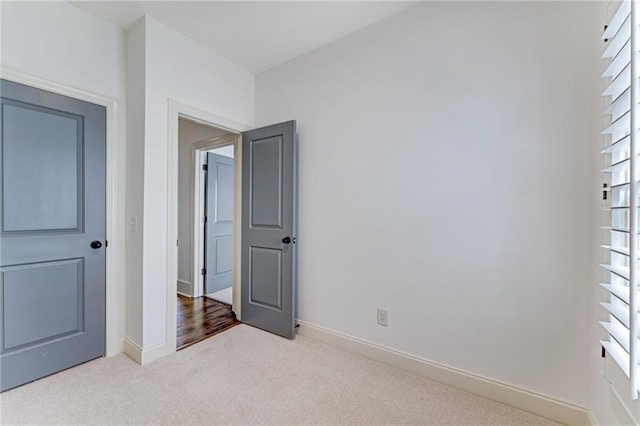 unfurnished bedroom with carpet