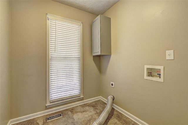 laundry area featuring washer hookup, visible vents, baseboards, cabinet space, and electric dryer hookup