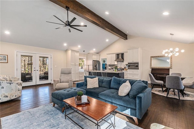 living room with french doors, dark wood finished floors, recessed lighting, lofted ceiling with beams, and ceiling fan with notable chandelier