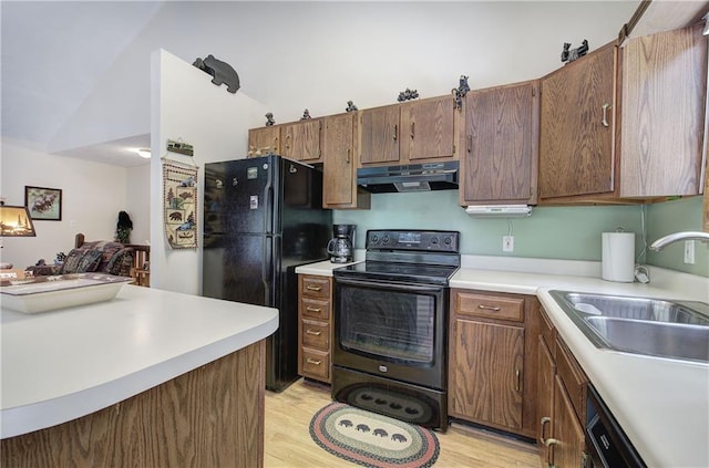214 S View Trl, Jasper, GA 30143 - kitchen with black appliances, extractor fan, light wood-style flooring, light countertops, and vaulted ceiling