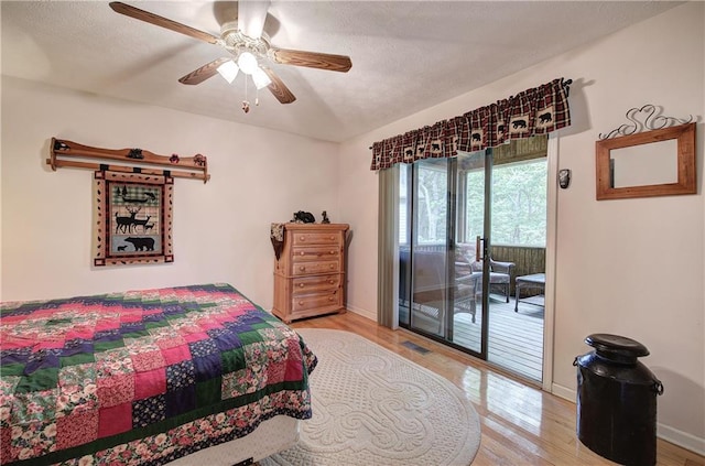 214 S View Trl, Jasper, GA 30143 - bedroom featuring access to exterior, light wood-style floors, ceiling fan, and a textured ceiling