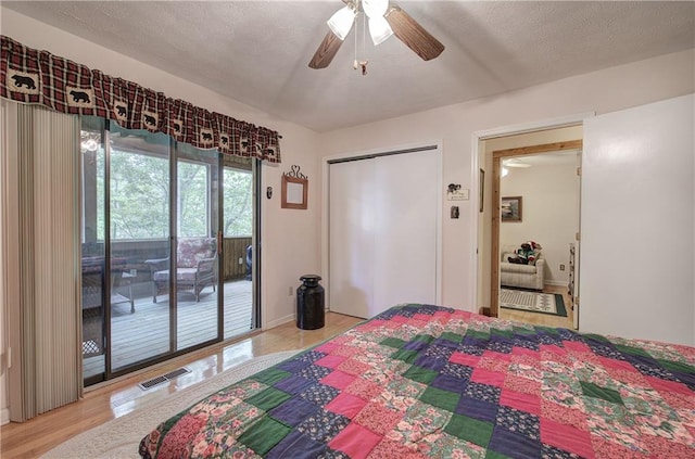 214 S View Trl, Jasper, GA 30143 - bedroom with access to outside, wood finished floors, a ceiling fan, and a closet