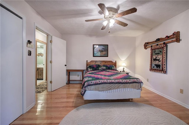 214 S View Trl, Jasper, GA 30143 - bedroom with light wood-type flooring, a textured ceiling, and a ceiling fan