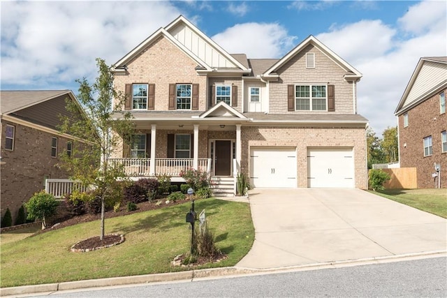 570 Eldridge Dr, Suwanee, GA 30024 - craftsman house featuring a garage, a front yard, board and batten siding, concrete driveway, and a porch