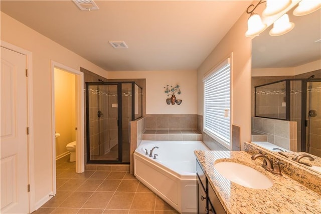570 Eldridge Dr, Suwanee, GA 30024 - full bathroom with a garden tub, vanity, toilet, tile patterned floors, and a shower stall