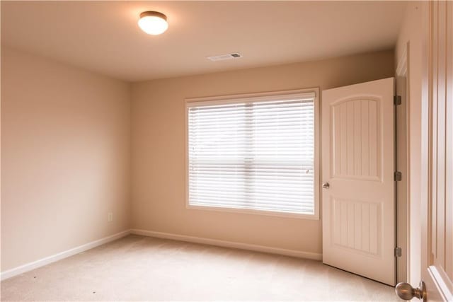570 Eldridge Dr, Suwanee, GA 30024 - spare room with baseboards, light colored carpet, a wealth of natural light, and visible vents