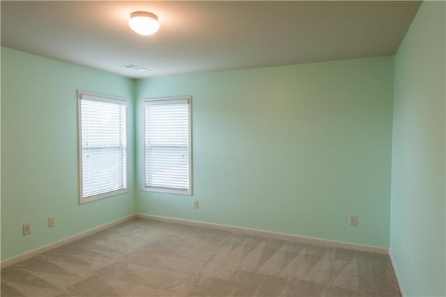 570 Eldridge Dr, Suwanee, GA 30024 - empty room with baseboards, visible vents, and light colored carpet
