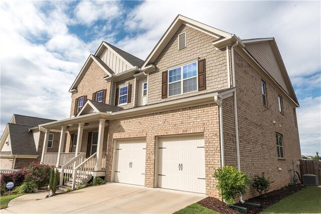 570 Eldridge Dr, Suwanee, GA 30024 - craftsman inspired home featuring a garage, central AC, brick siding, concrete driveway, and a porch