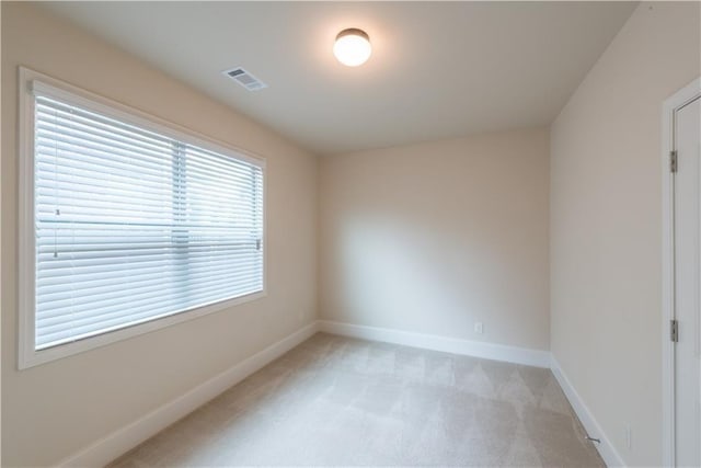 570 Eldridge Dr, Suwanee, GA 30024 - spare room featuring baseboards, light colored carpet, and visible vents
