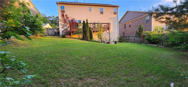 570 Eldridge Dr, Suwanee, GA 30024 - back of property with a lawn, a wooden deck, and a fenced backyard