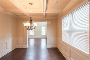 570 Eldridge Dr, Suwanee, GA 30024 - unfurnished dining area with an inviting chandelier, coffered ceiling, dark wood-style flooring, and beam ceiling