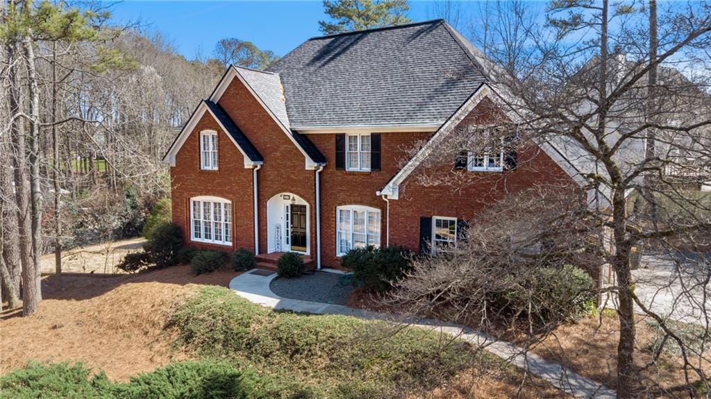 5679 Brookstone Walk NW, Acworth, GA 30101 - view of front facade with brick siding and roof with shingles