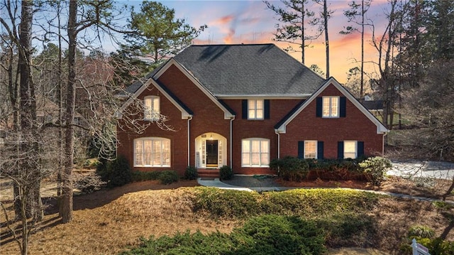 view of front of house with brick siding