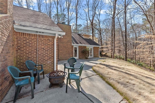 view of patio with a fire pit