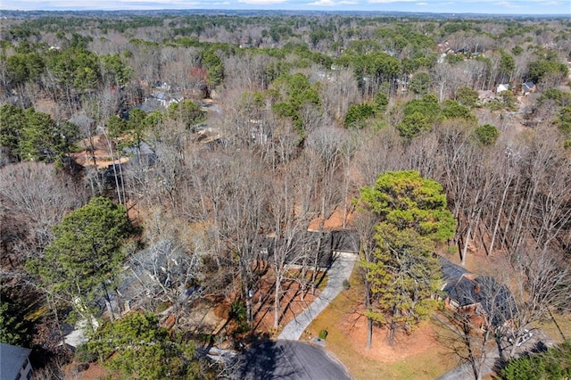 bird's eye view featuring a wooded view