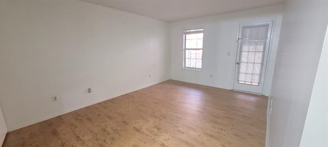 unfurnished room featuring light hardwood / wood-style flooring