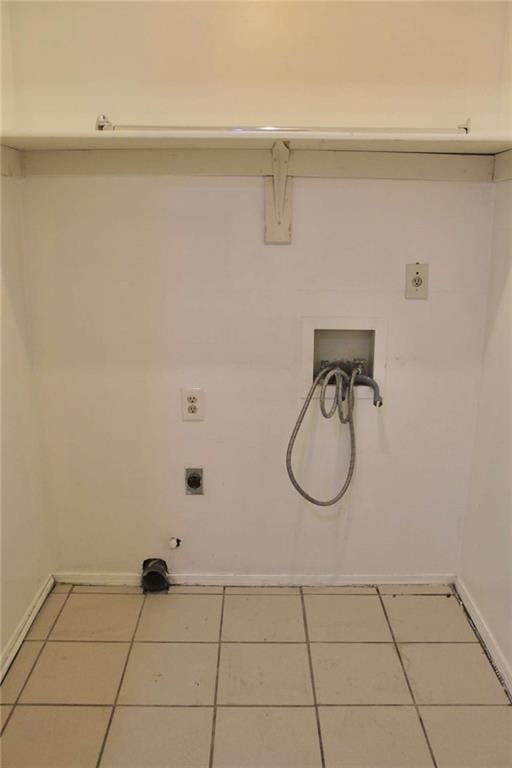 washroom with tile patterned floors, hookup for an electric dryer, hookup for a gas dryer, and hookup for a washing machine