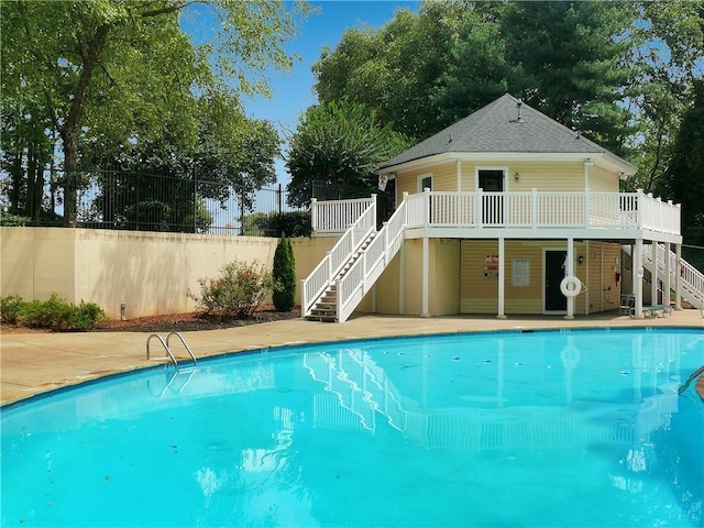 view of swimming pool featuring a deck