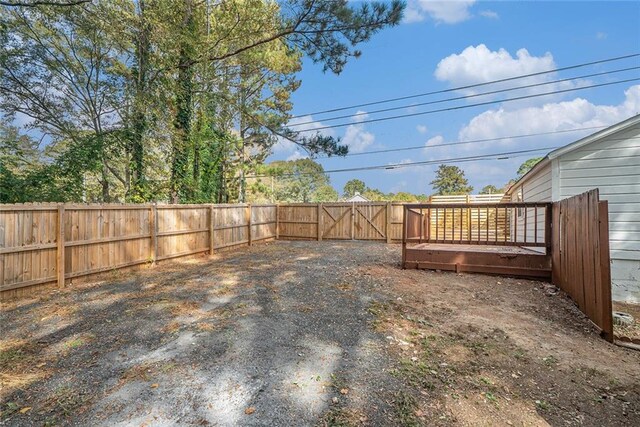 view of yard with a wooden deck