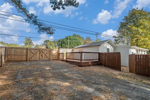 view of yard featuring a wooden deck