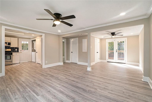 unfurnished living room featuring french doors, light hardwood / wood-style flooring, and a wealth of natural light