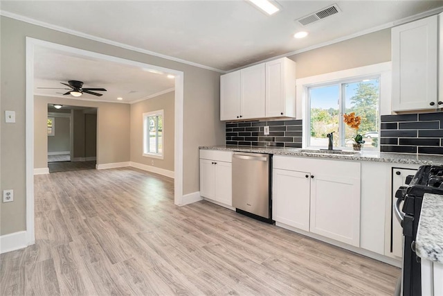 kitchen with white cabinetry, a healthy amount of sunlight, appliances with stainless steel finishes, and light wood-type flooring