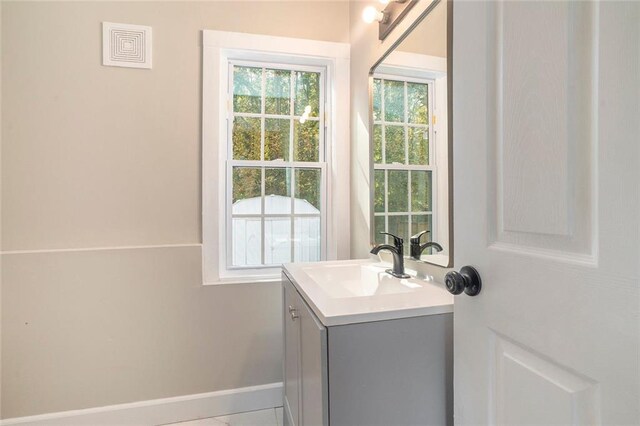 bathroom with vanity and tile patterned flooring