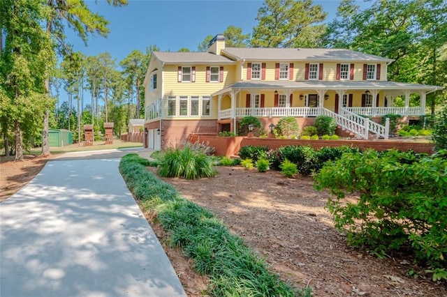 view of front of house with a garage and covered porch