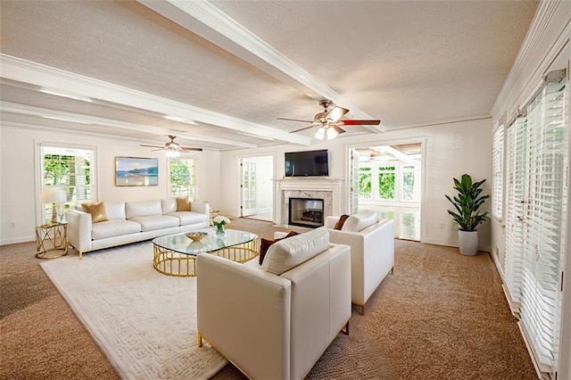 carpeted living room featuring a high end fireplace, a textured ceiling, and beamed ceiling