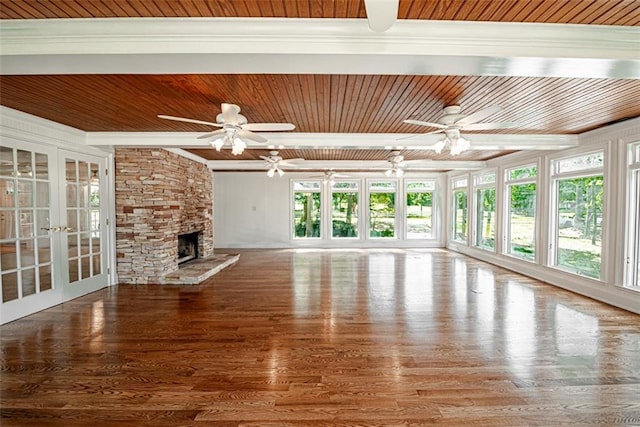 unfurnished living room featuring ceiling fan and wooden ceiling